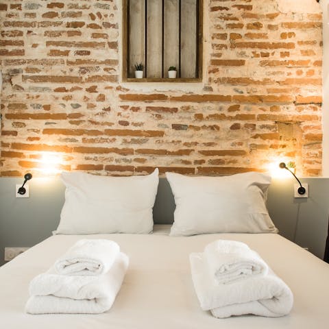 Doze off under the crisp, white sheets after a busy day spent exploring