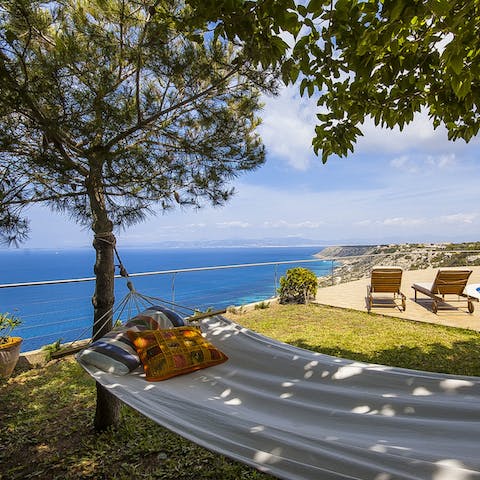 Drink in the sea views while drifting in a hammock