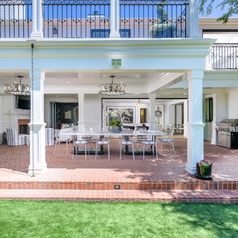 Gather in the shaded dining area for alfresco dinners
