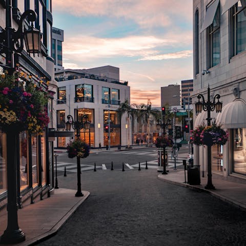 Browse luxury boutiques at Rodeo Drive, a fifteen-minute walk away