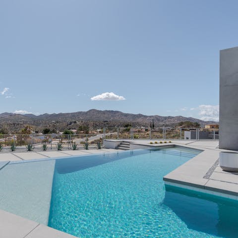 Take refreshing dips in the luxurious infinity pool with breathtaking vistas around you