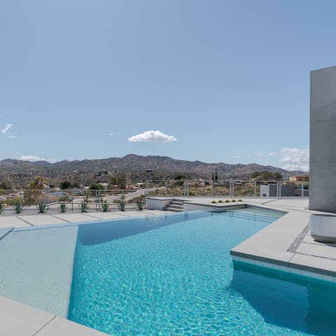 Take refreshing dips in the luxurious infinity pool with breathtaking vistas around you