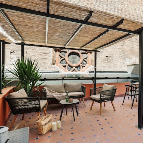 Curl up on the outdoor sofa with a good book and a glass of wine