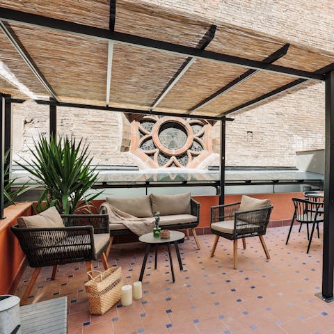 Curl up on the outdoor sofa with a good book and a glass of wine