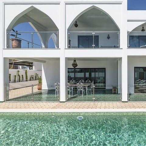 Take a cooling dip in the turquoise waters of the private pool