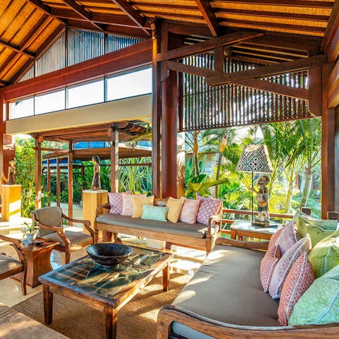 Gather in the open-air living room for serene sunset drinks