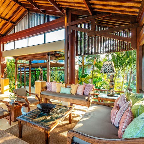 Gather in the open-air living room for serene sunset drinks