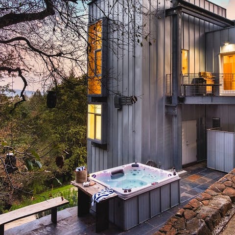 Unwind in the hot tub and enjoy the magnificent views