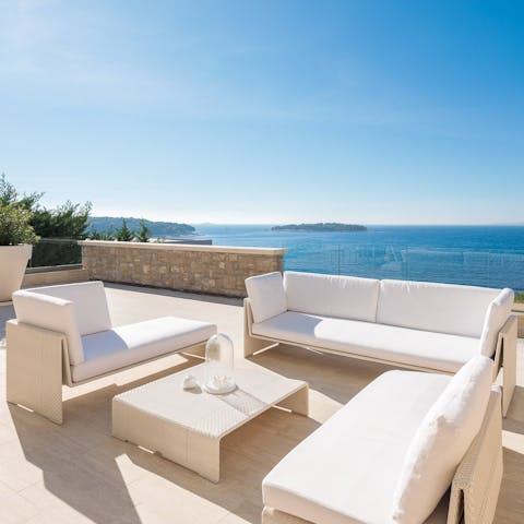 Drink in stunning sea views over a cocktail or two or swim in the pool