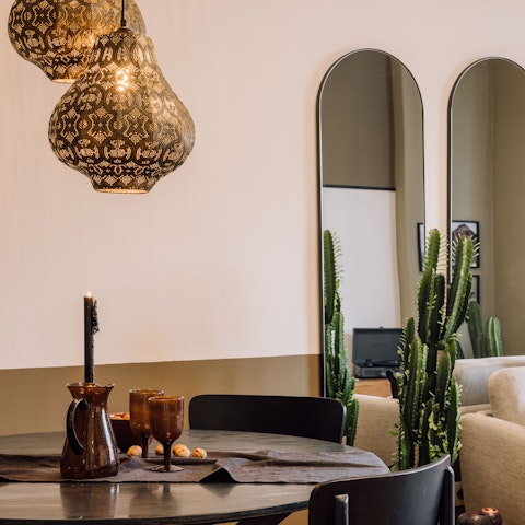 Gather below the decorative lamps of the dining table to sample Portuguese wines