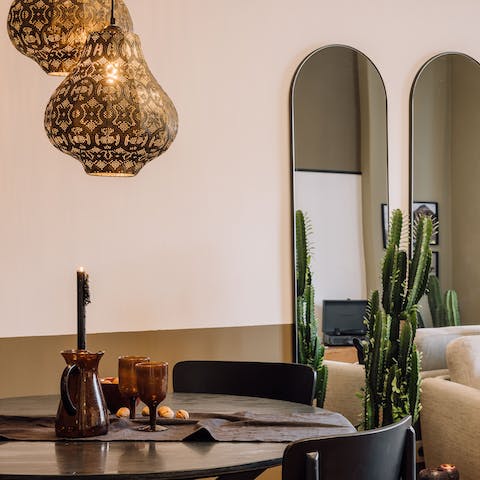 Gather below the decorative lamps of the dining table to sample Portuguese wines