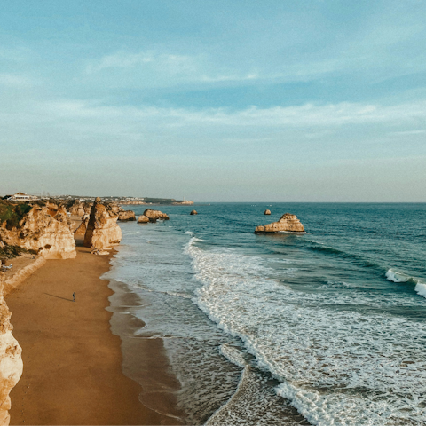 Take the short car ride to Praia da Rocha and relax on the sand