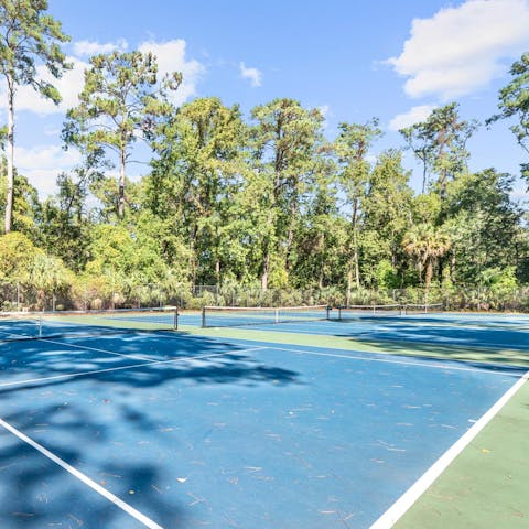 Embrace friendly competition on the communal tennis courts