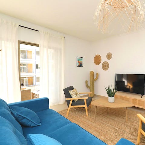 Hang out in the boho-inspired living space with a glass of green wine