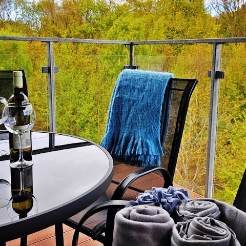Enjoy a glass of wine on the balcony