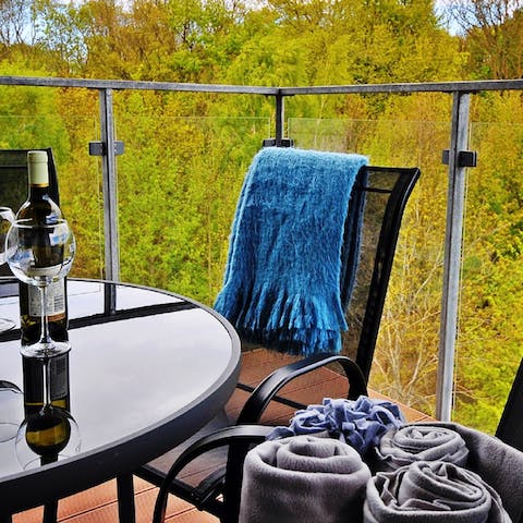 Enjoy a glass of wine on the balcony
