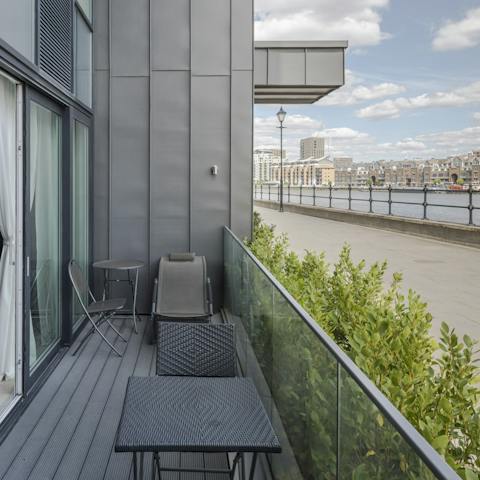 Step out to your terrace overlooking the river and enjoy a morning cup of coffee