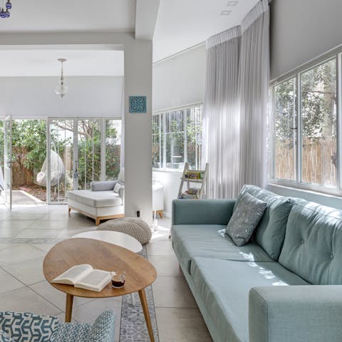 Relax with plenty of comfy lounging space, both inside and in the garden