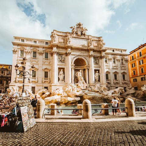 Stroll fifteen minutes to Trevi Fountain