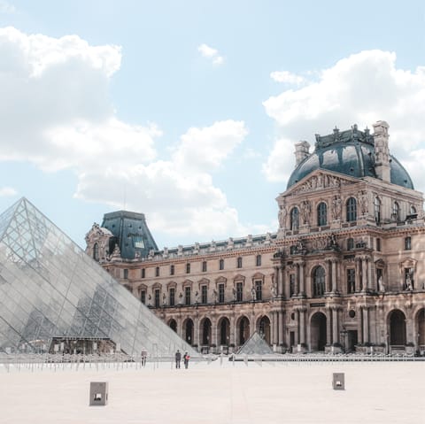 Visit the iconic Louvre museum, a fifteen-minute walk away