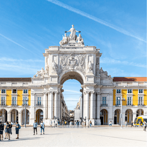 Stroll around bustling Praça do Comércio, a one-minute walk away