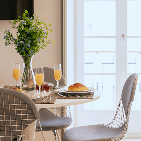 Start mornings with fresh coffee and pastéis de nata at the window-side table