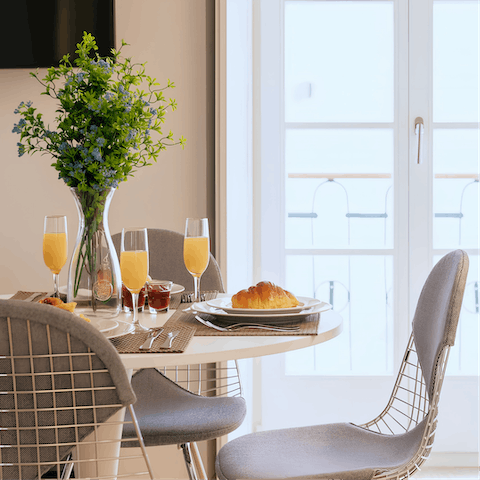 Start mornings with fresh coffee and pastéis de nata at the window-side table