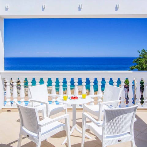 Sip your morning juice on the balcony as you drink in the sea views