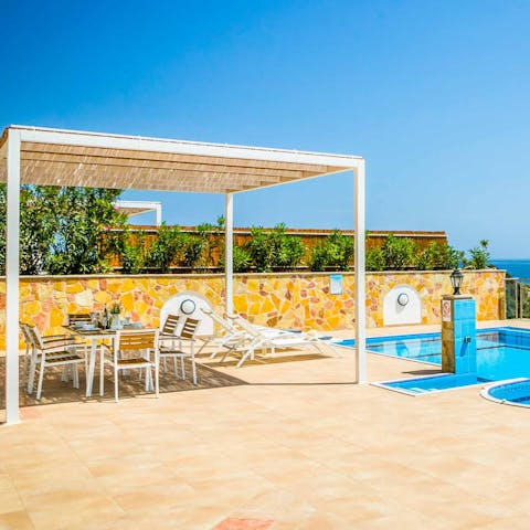 Enjoy an alfresco meal with loved ones under the shade of the pergola