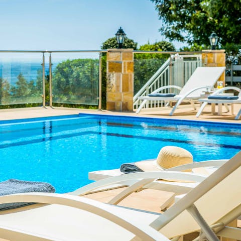 Sink into the private pool to cool off in the Greek heat