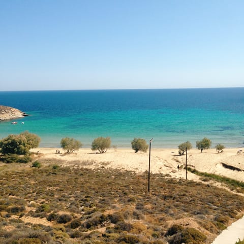 Take a walk or short drive to the long stretch of sand at Skala beach