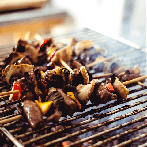 Fire up the home's charcoal grill for an evening barbecue