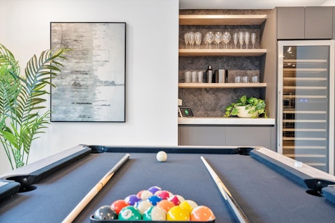 Challenge friends to a game of pool, then pour a celebratory drink