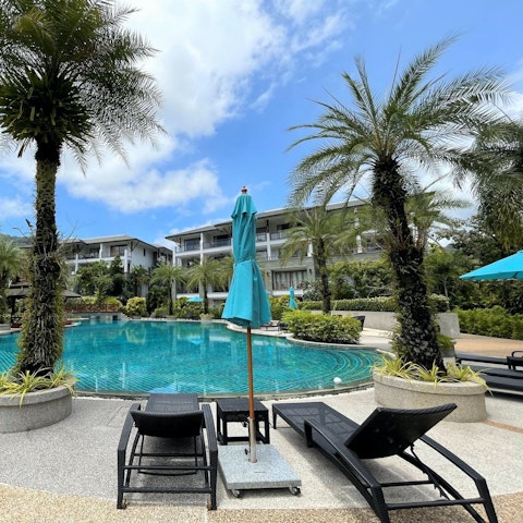 Soak up the sun by the shared swimming pool