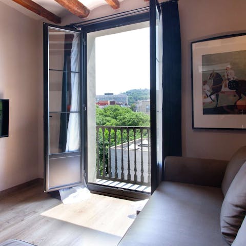 Open the French doors to the Juliet balcony for more vistas of the city