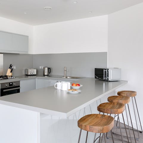 Sip your morning cup of java at the sleek breakfast bar