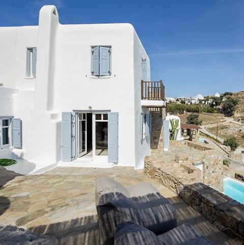 Enjoy the blend of traditional Greek architecture with modern fixtures and features that makes this a truly unique home