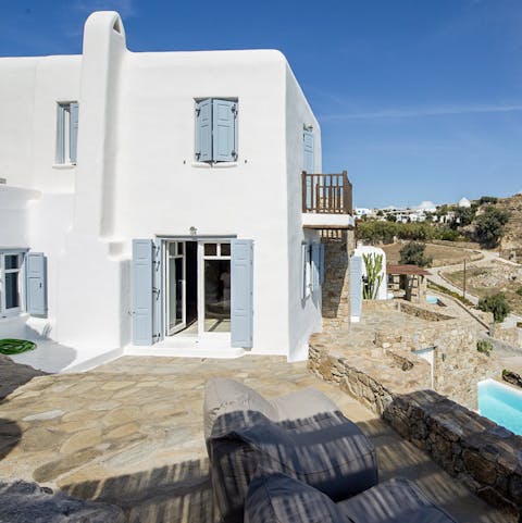 Enjoy the blend of traditional Greek architecture with modern fixtures and features that makes this a truly unique home