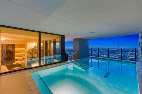 Swim above the Miami skyline as the city lights up
