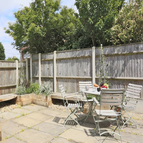 Sip a sundowner in the sunny courtyard garden