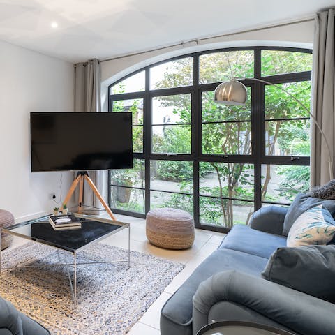 Get cosy in the plush living area and enjoy an evening of movies with your loved ones