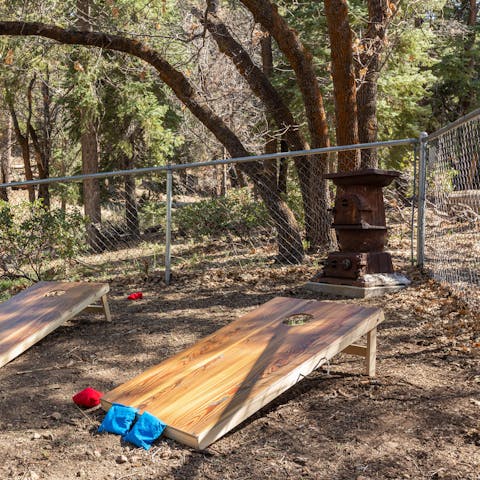 Engage in a game of cornhole while the sun shines