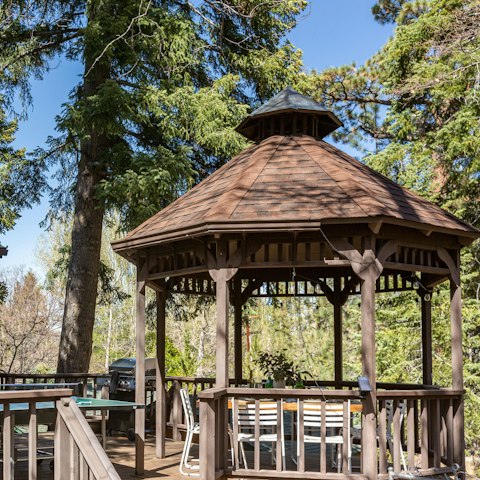 Dine in the shade of the gazebo in the pine trees