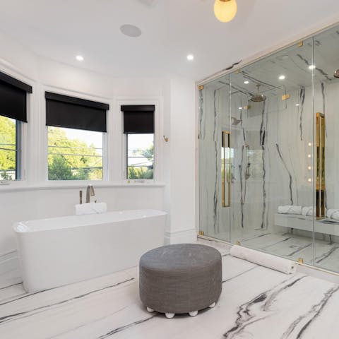 Treat yourself to a full pampering experience in the spa-like bathroom