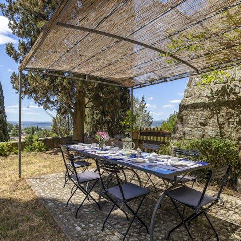 Enjoy alfresco dining on the terrace with views overlooking the lush countryside