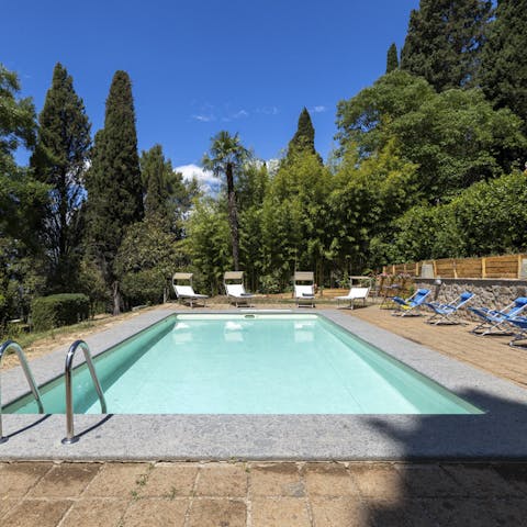 Plunge into the turquoise waters of the outdoor pool