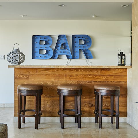 Opt for a gin and tonic at your indoor bar