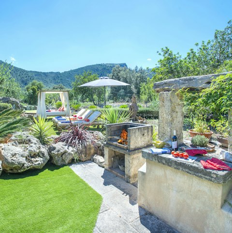 Whip up something tasty in this amazing outdoor kitchen that offers a pretty incredible view too