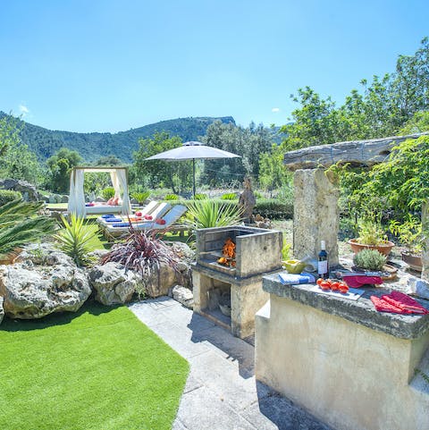 Whip up something tasty in this amazing outdoor kitchen that offers a pretty incredible view too