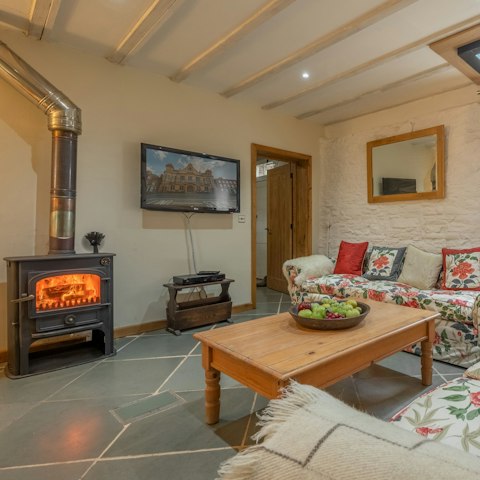 Stay cosy by the heat of the wood burner